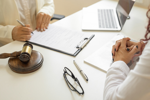 Business woman and lawyers discussing contract